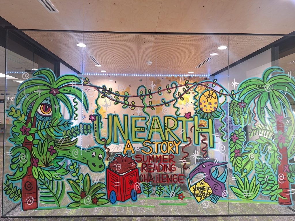 Painted mural of dinosaur in a jungle.